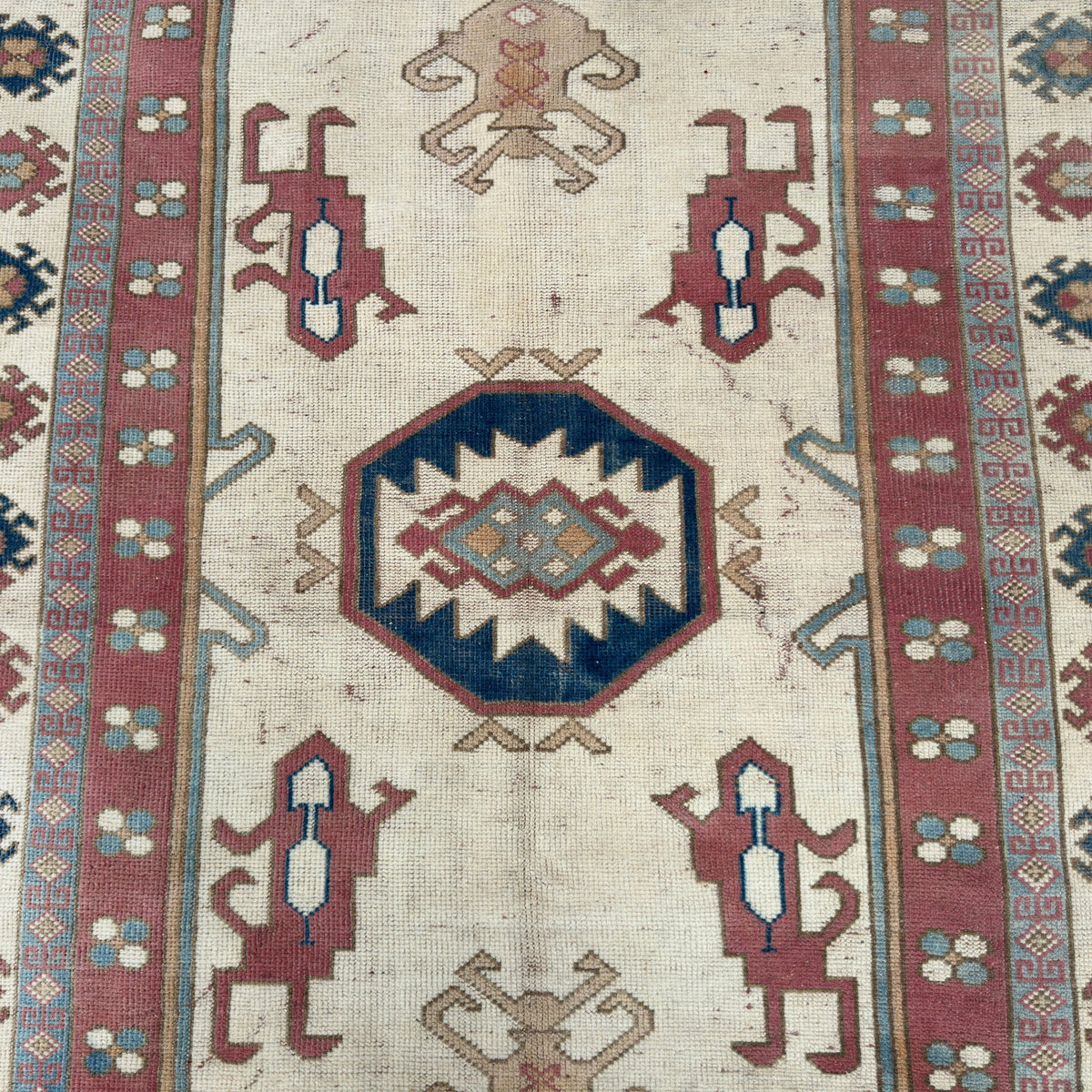 1970s pink vintage turkish rug with traditional design, hand-knotted weave and low pile.