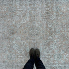 1970s beige vintage turkish rug with floral design, hand-knotted weave and low pile.