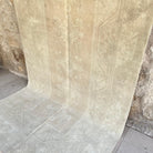 Beige 5' x 9' vintage turkish rug in wool and cotton, shown on the floor.