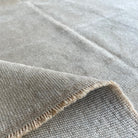 1970s beige vintage turkish rug with neutral design, hand-knotted weave and low pile.