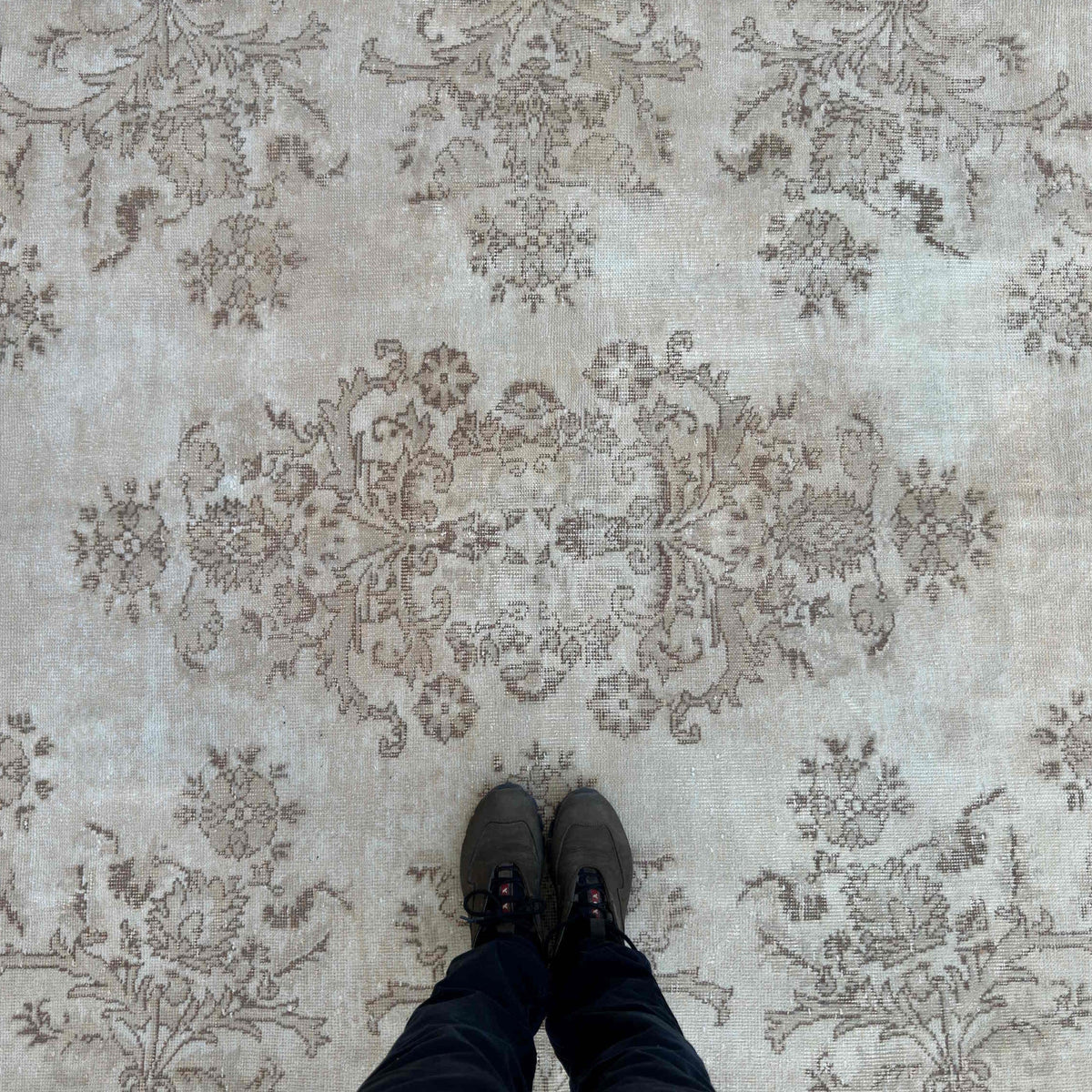 1970s beige vintage turkish rug with neutral design, hand-knotted weave and low pile.