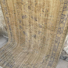 Blue 5' x 9' vintage turkish rug in wool and cotton, shown on the floor.