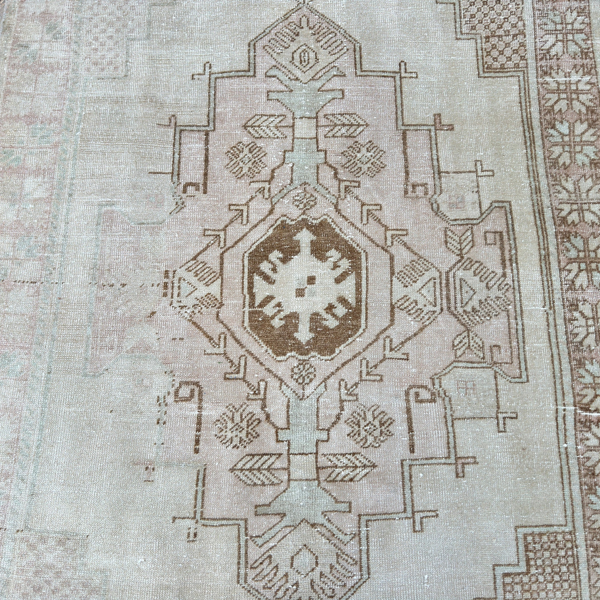 1970s brown vintage turkish rug with geometric design, hand-knotted weave and low pile.