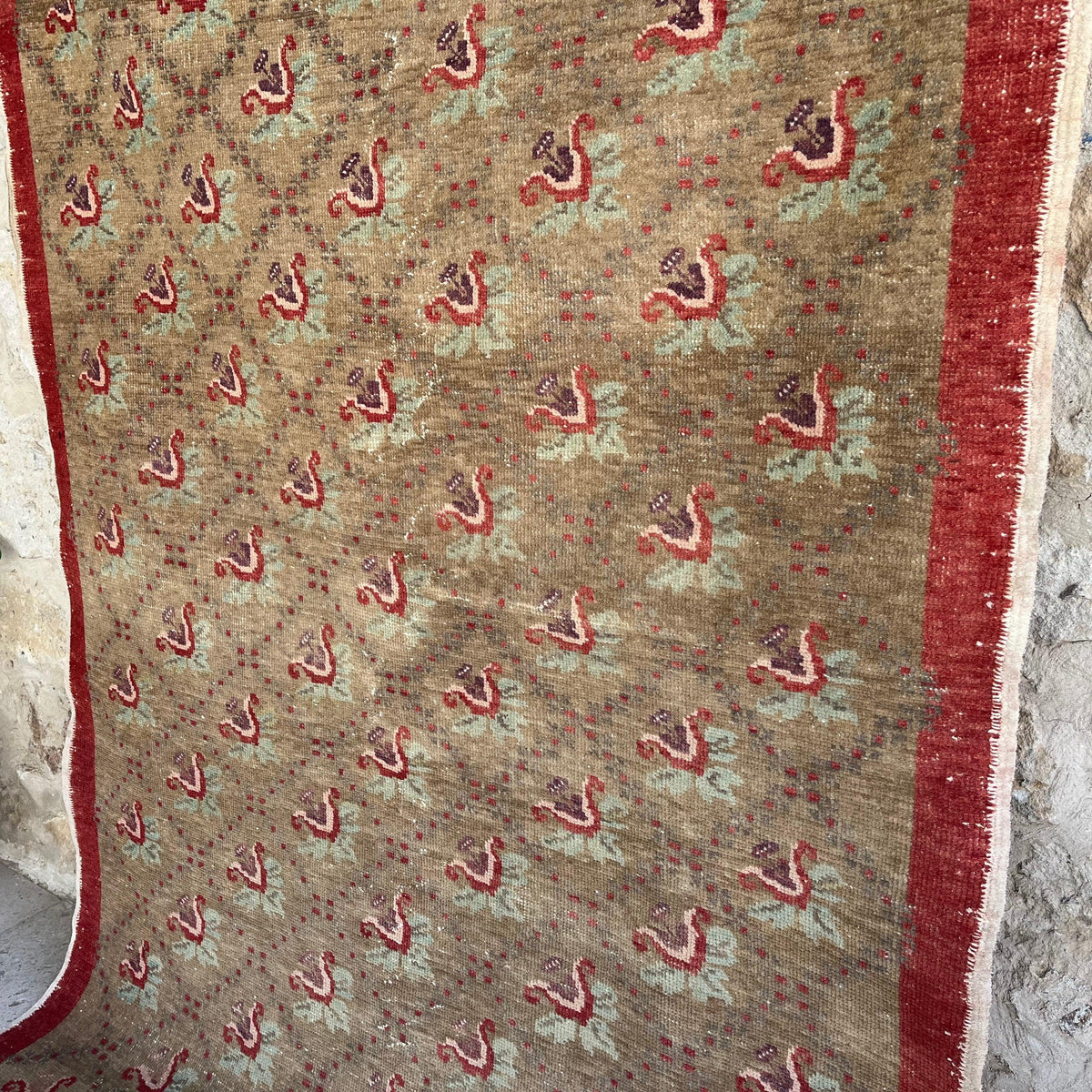 1970s brown vintage turkish rug with floral design, hand-knotted weave and low pile.
