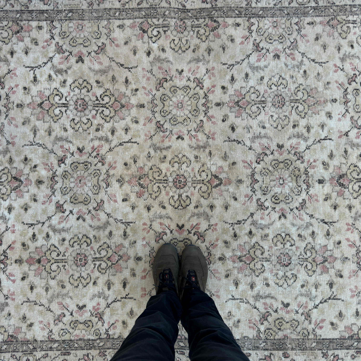 1970s brown vintage turkish rug with floral design, hand-knotted weave and low pile.