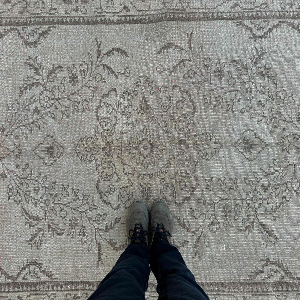 1970s brown vintage turkish rug with traditional design, hand-knotted weave and low pile.