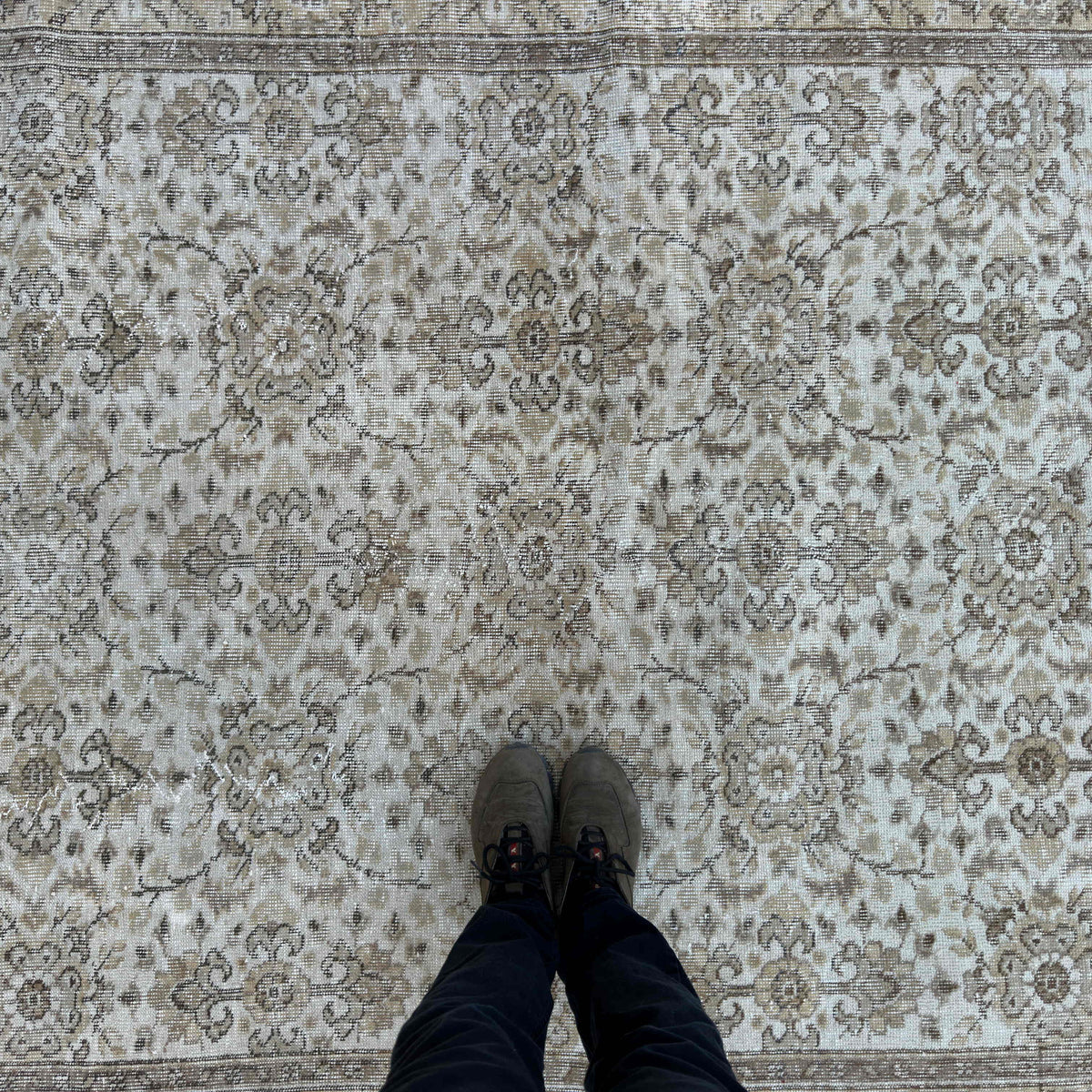 1970s brown vintage turkish rug with floral design, hand-knotted weave and low pile.