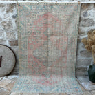 Red 5' x 9' vintage turkish rug with medallion design, handmade in Turkey – Saif.
