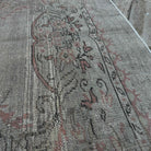 Close-up of the beige vintage turkish rug showing neutral details, hand-knotted weave, wool and cotton and low pile.
