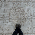 1970s beige vintage turkish rug with medallion design, hand-knotted weave and low pile.