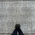 1970s beige vintage turkish rug with floral design, hand-knotted weave and low pile.