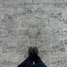 1970s beige vintage turkish rug with medallion design, hand-knotted weave and low pile.