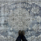1970s beige vintage turkish rug with medallion design, hand-knotted weave and low pile.