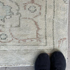 1970s beige vintage turkish rug with neutral design, hand-knotted weave and low pile.