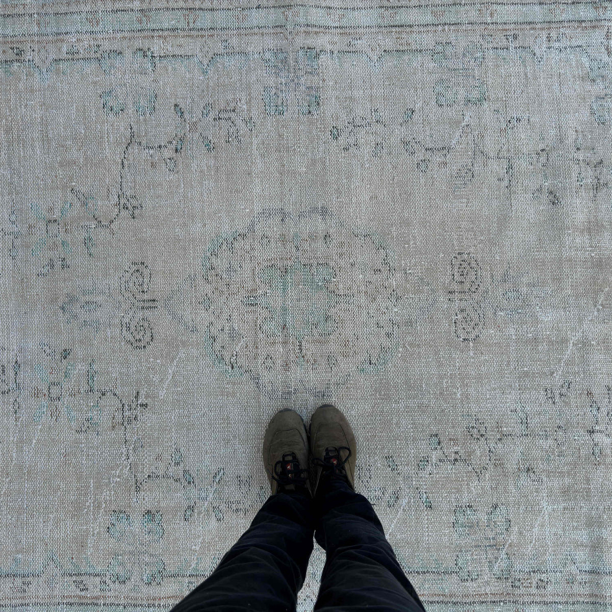 1970s beige vintage turkish rug with neutral design, hand-knotted weave and low pile.