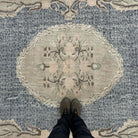 1970s blue vintage turkish rug with medallion design, hand-knotted weave and low pile.