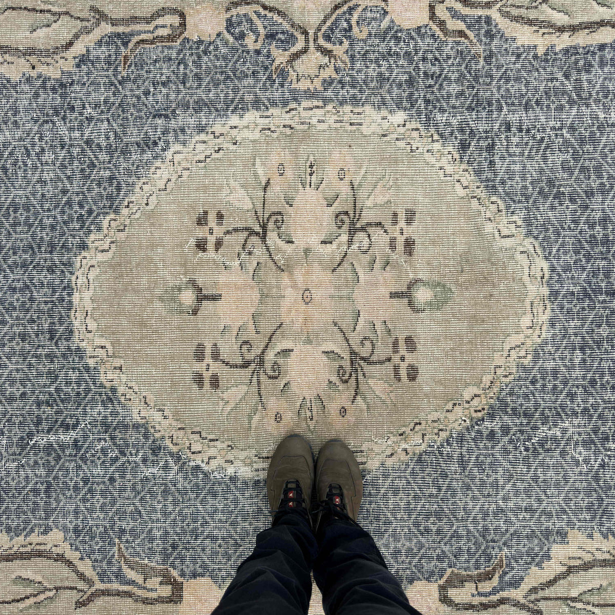 1970s blue vintage turkish rug with medallion design, hand-knotted weave and low pile.