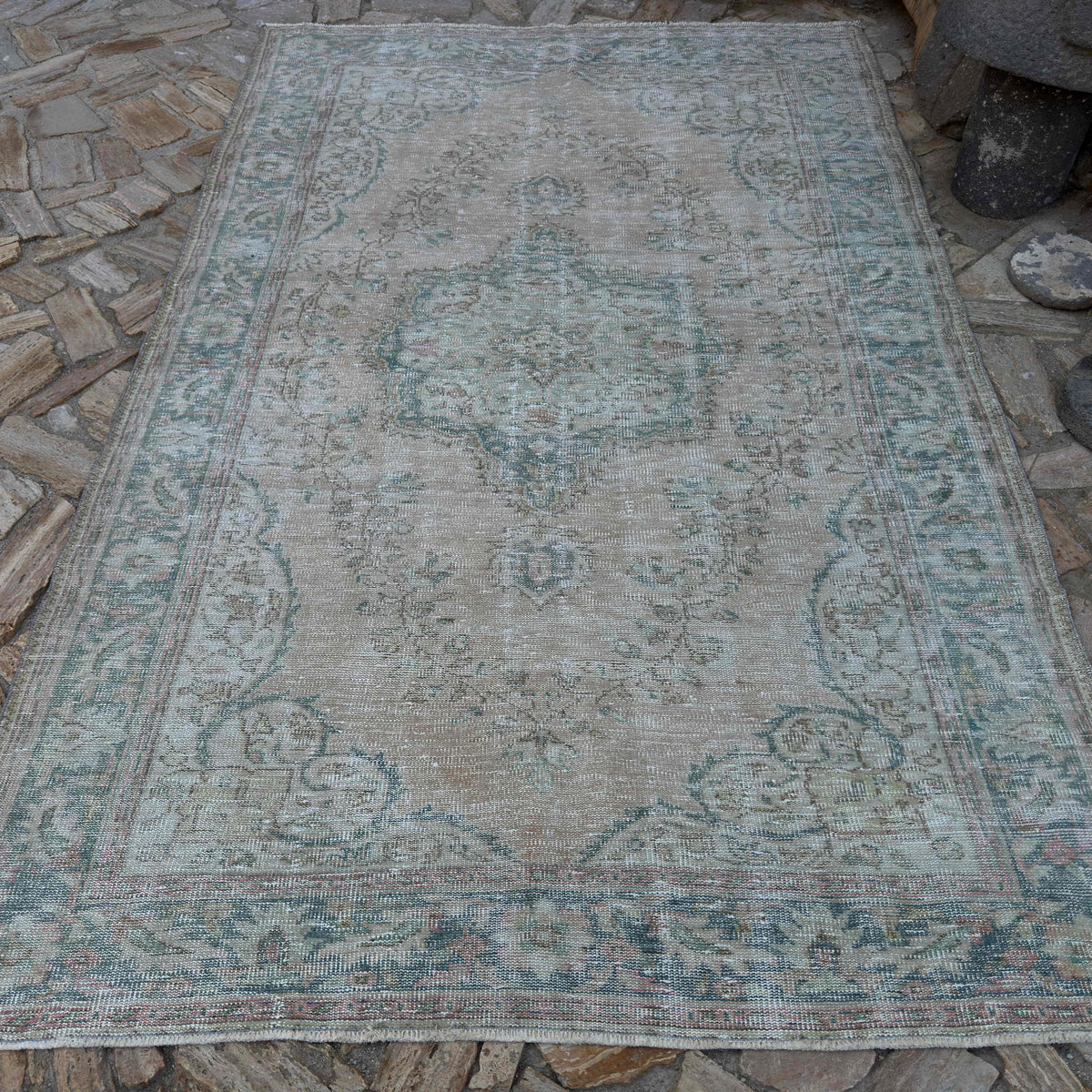 Blue 6' x 10' vintage turkish rug in wool and cotton, shown on the floor.