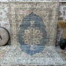Blue 6' x 10' vintage turkish rug with medallion design, handmade in Turkey – Zarah.
