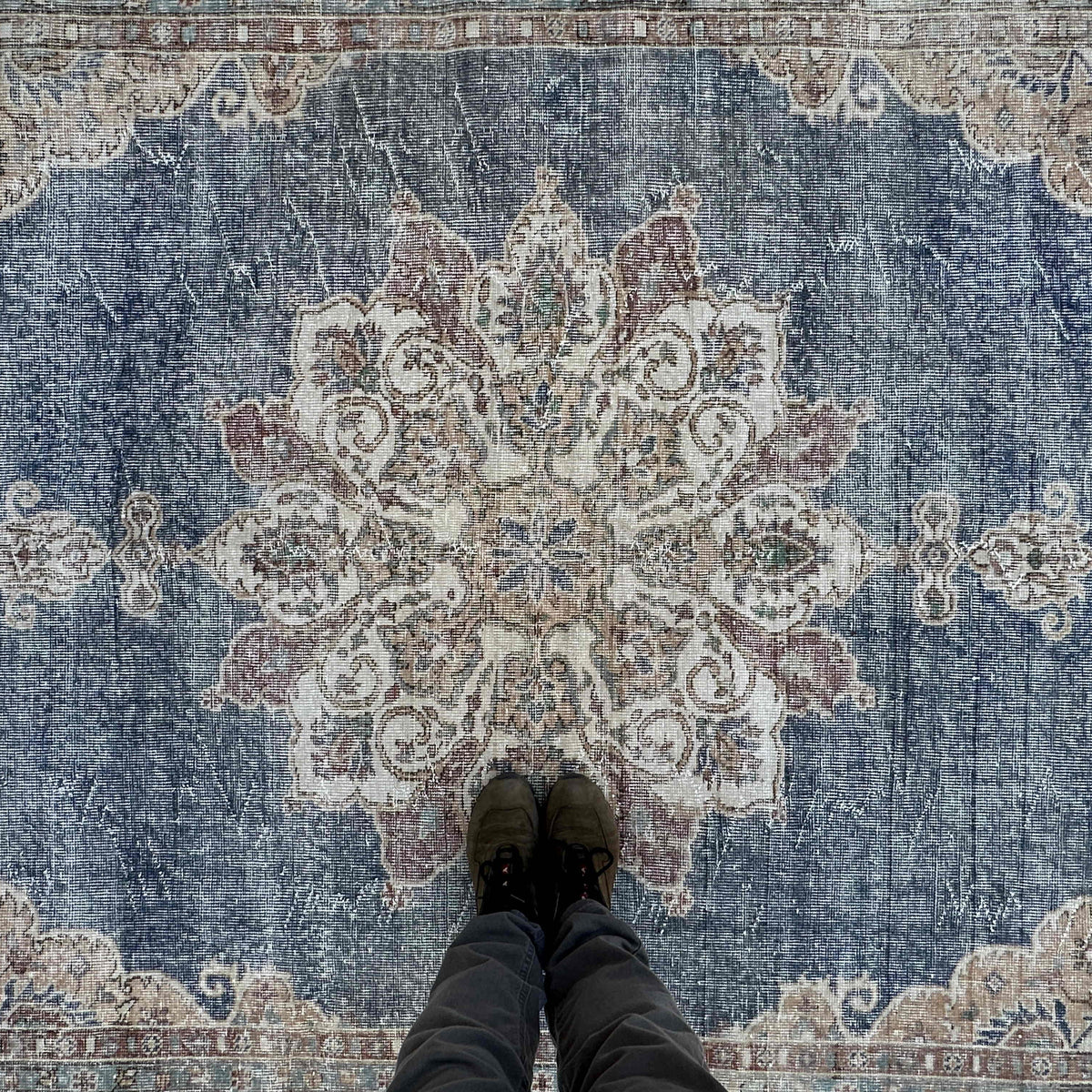 1970s blue vintage turkish rug with medallion design, hand-knotted weave and low pile.