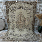 Brown 6' x 10' vintage turkish rug with medallion design, handmade in Turkey – Mitchell.