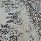 Close-up of the brown vintage turkish rug showing medallion details, hand-knotted weave, wool and cotton and low pile.