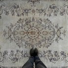 1970s brown vintage turkish rug with medallion design, hand-knotted weave and low pile.
