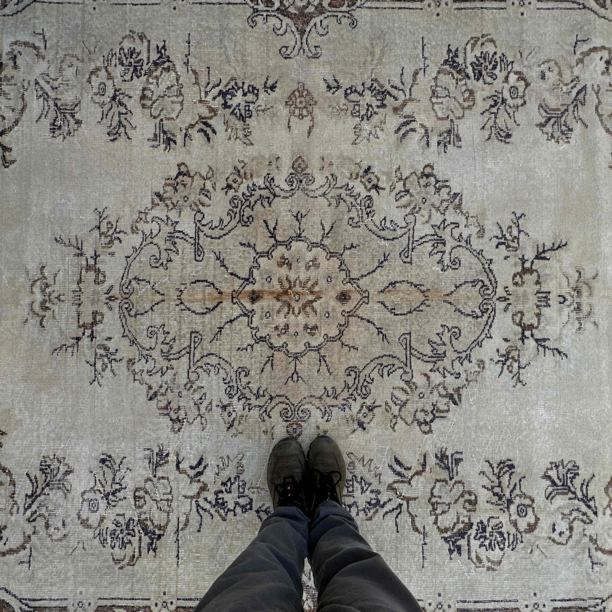 1970s brown vintage turkish rug with medallion design, hand-knotted weave and low pile.