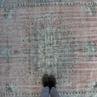 1970s pink vintage turkish rug with medallion design, hand-knotted weave and low pile.