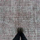 1970s red vintage turkish rug with floral design, hand-knotted weave and low pile.