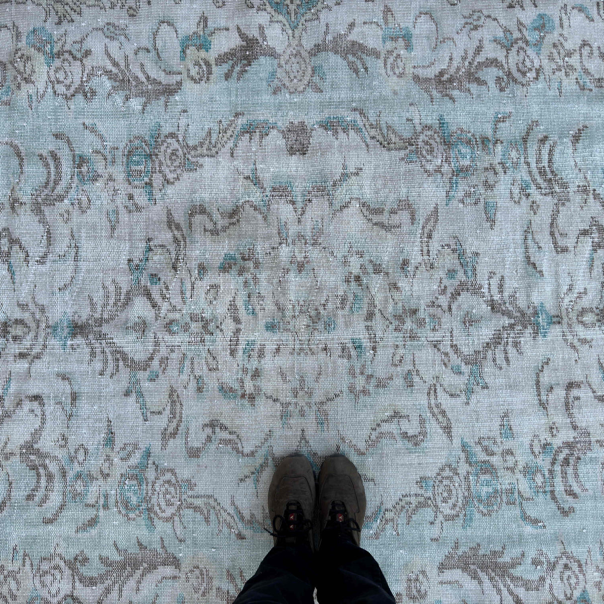 1970s blue vintage turkish rug with medallion design, hand-knotted weave and low pile.