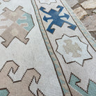 Close-up of the blue vintage turkish rug showing traditional details, hand-knotted weave, wool and cotton and low pile.