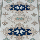 1970s blue vintage turkish rug with traditional design, hand-knotted weave and low pile.