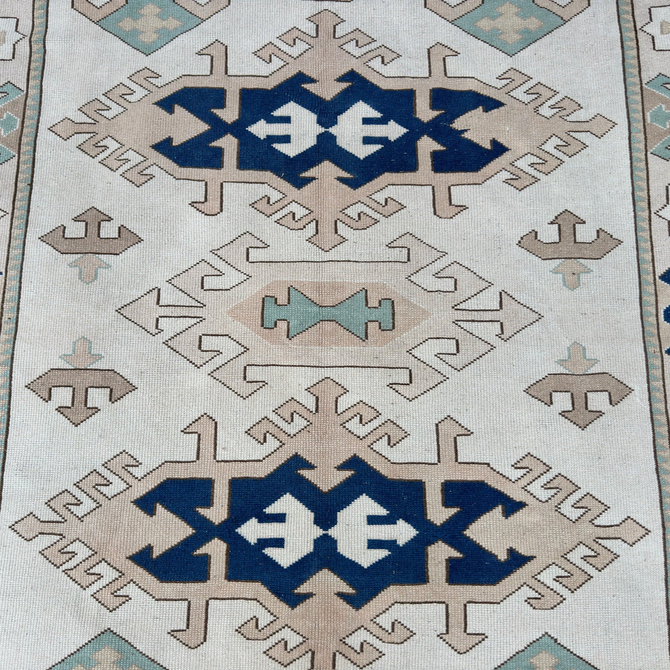 1970s blue vintage turkish rug with traditional design, hand-knotted weave and low pile.