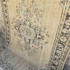 Blue 6' x 8' vintage turkish rug in wool and cotton, shown on the floor.