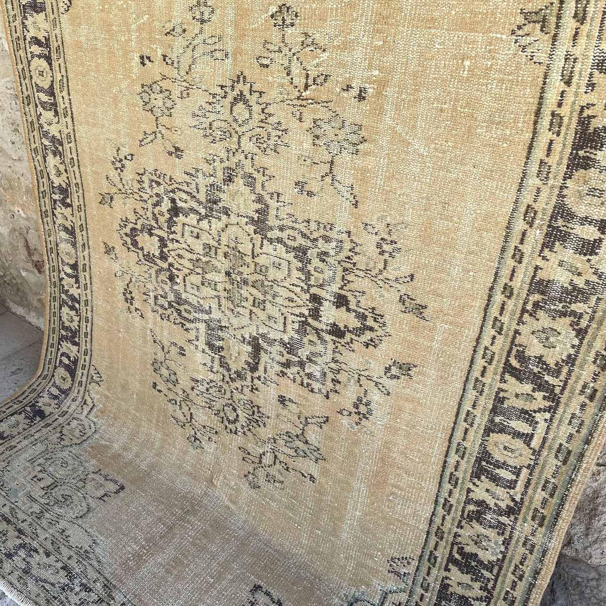 Blue 6' x 8' vintage turkish rug in wool and cotton, shown on the floor.