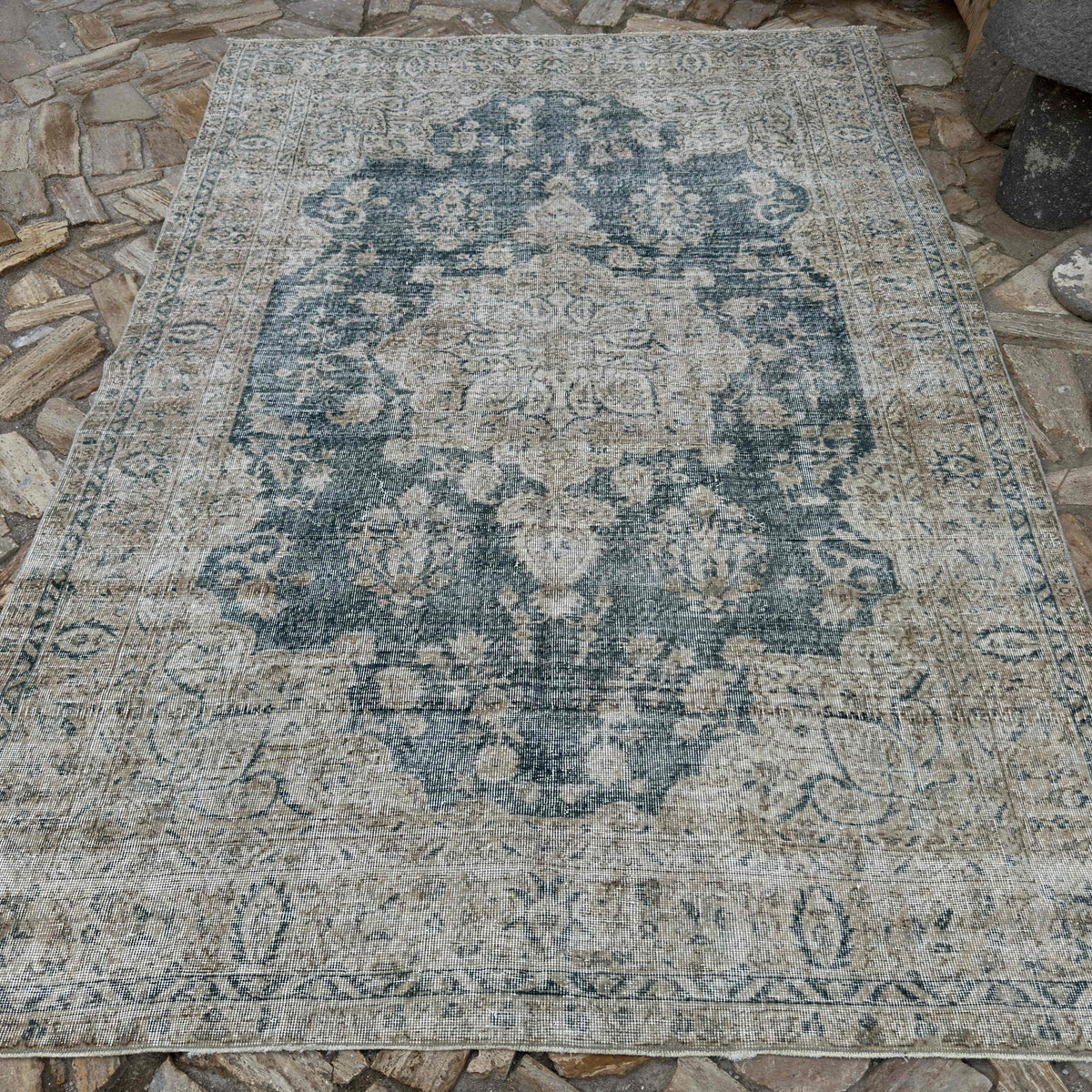 Blue 6' x 9' vintage turkish rug in wool and cotton, shown on the floor.