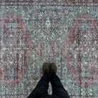 1970s green vintage turkish rug with traditional design, hand-knotted weave and low pile.