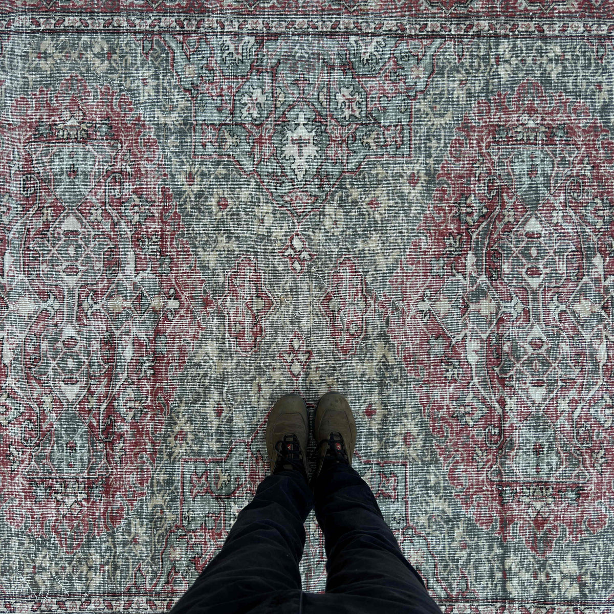 1970s green vintage turkish rug with traditional design, hand-knotted weave and low pile.
