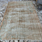 Pale Orange 6' x 9' vintage turkish rug in wool and cotton, shown on the floor.