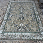 Yellow 6' x 9' vintage turkish rug in wool and cotton, shown on the floor.