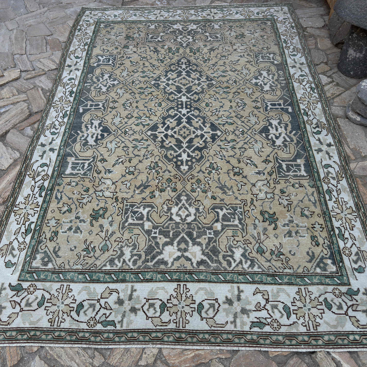 Yellow 6' x 9' vintage turkish rug in wool and cotton, shown on the floor.