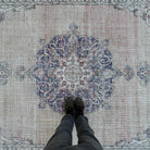 1970s beige vintage turkish rug with medallion design, hand-knotted weave and low pile.
