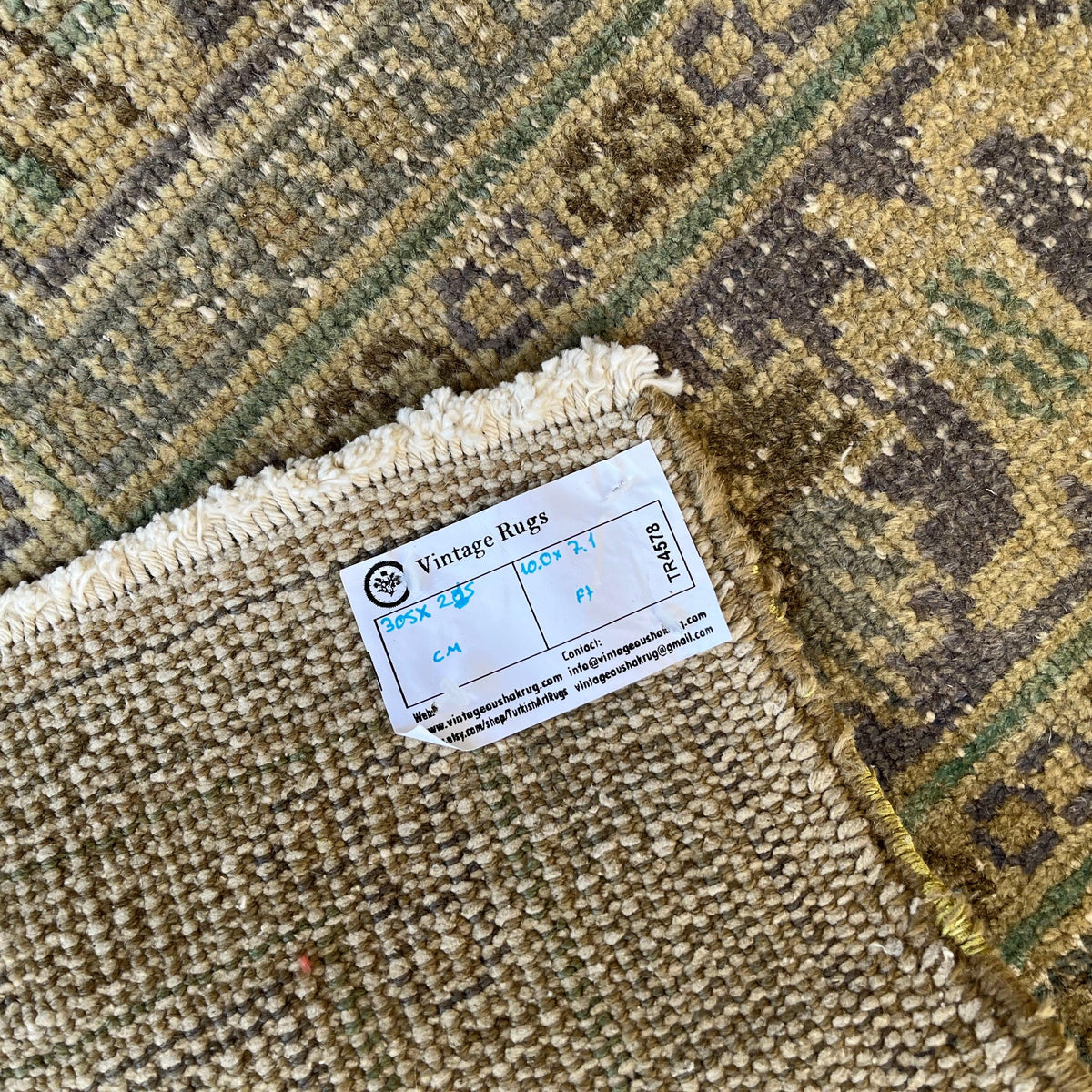 1970s beige vintage turkish rug with traditional design, hand-knotted weave and low pile.
