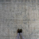 1970s beige vintage turkish rug with neutral design, hand-knotted weave and low pile.