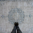 1970s blue vintage turkish rug with neutral design, hand-knotted weave and low pile.