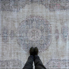 1970s blue vintage turkish rug with medallion design, hand-knotted weave and low pile.