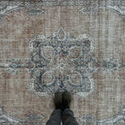 1970s orange vintage turkish rug with medallion design, hand-knotted weave and low pile.