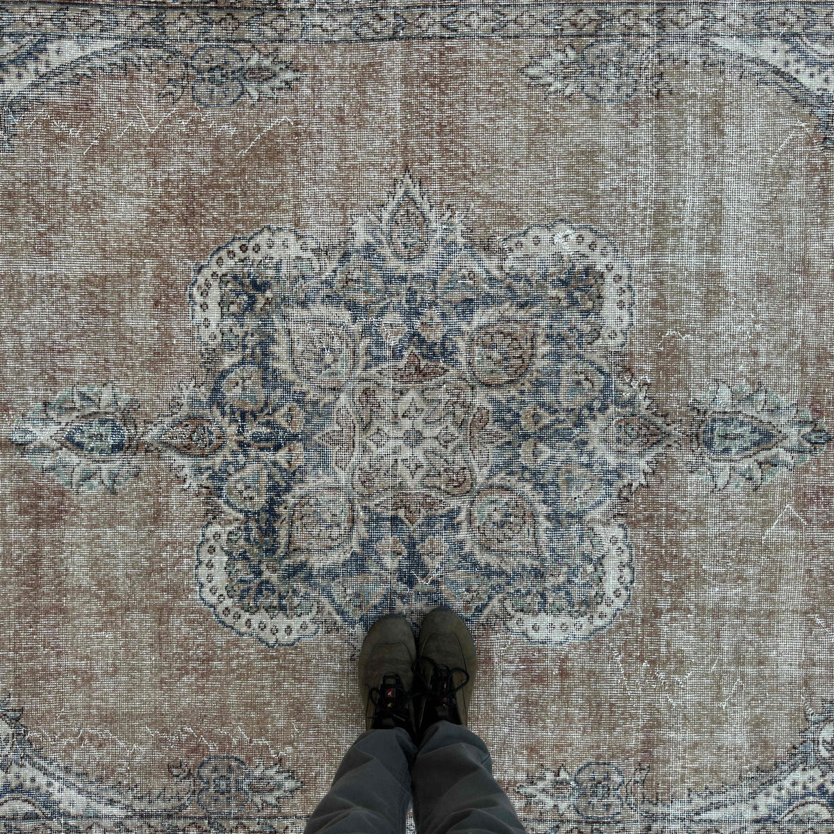 1970s orange vintage turkish rug with medallion design, hand-knotted weave and low pile.