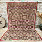Pink 7' x 11' vintage turkish rug with floral and geometric design, handmade in Turkey – Elliott.